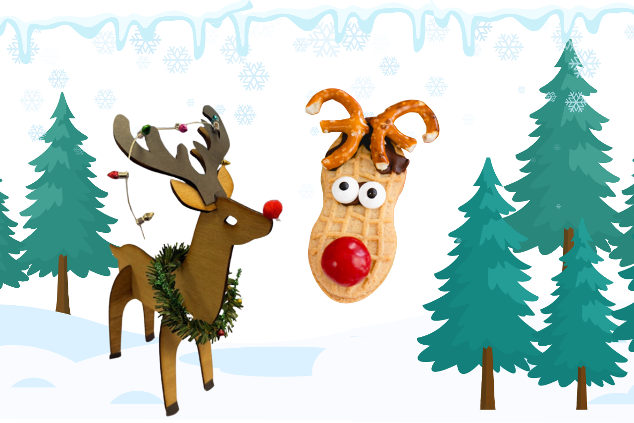 snowy background with a wooden reindeer with holiday decorations and a reindeer made from a peanut butter cookie