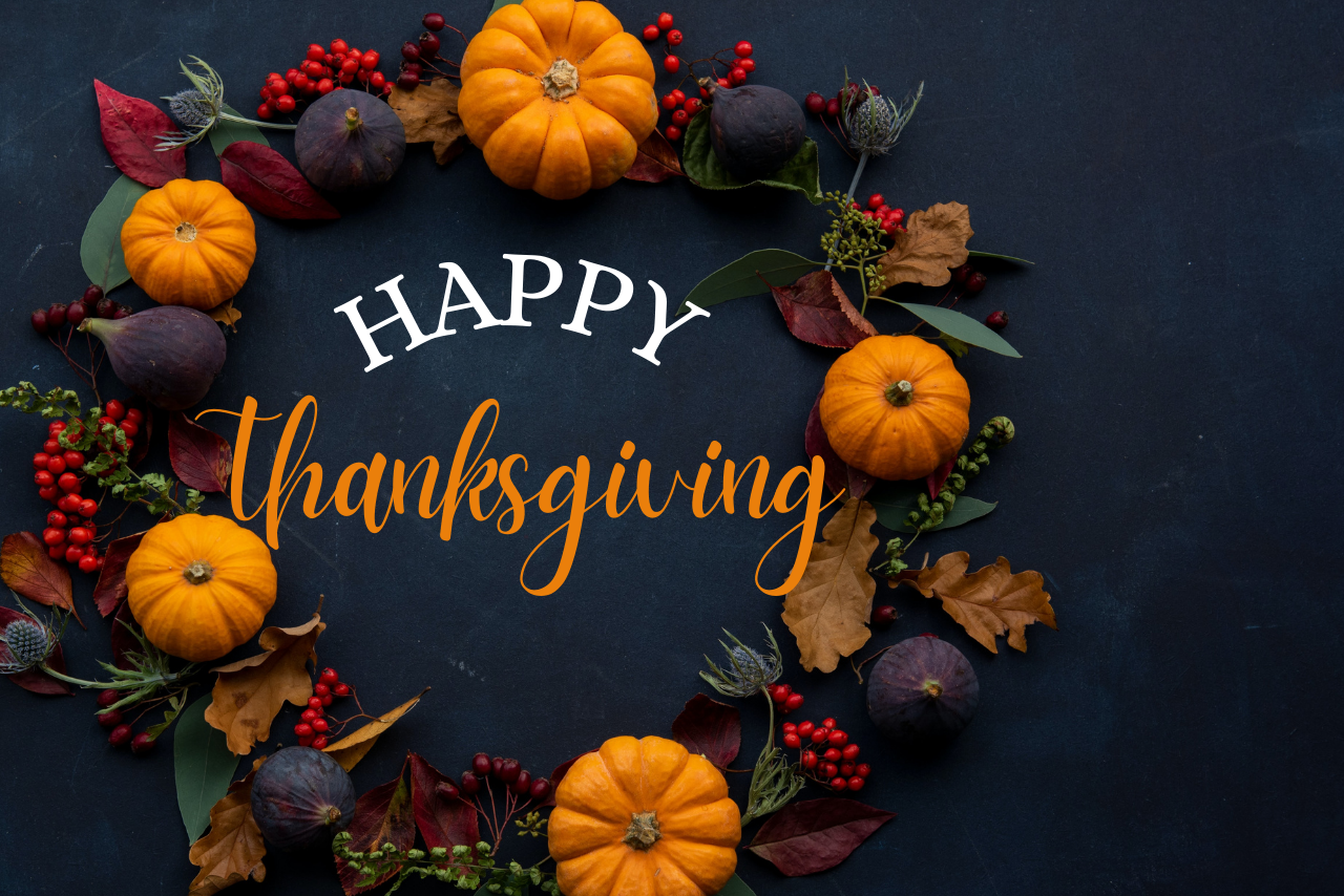 a fall wreath with the words, "Happy Thanksgiving"