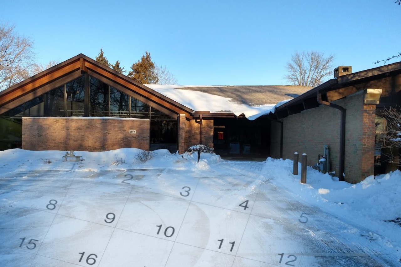 Snow covering the Pemberville Public Library and a faded calendar overtop