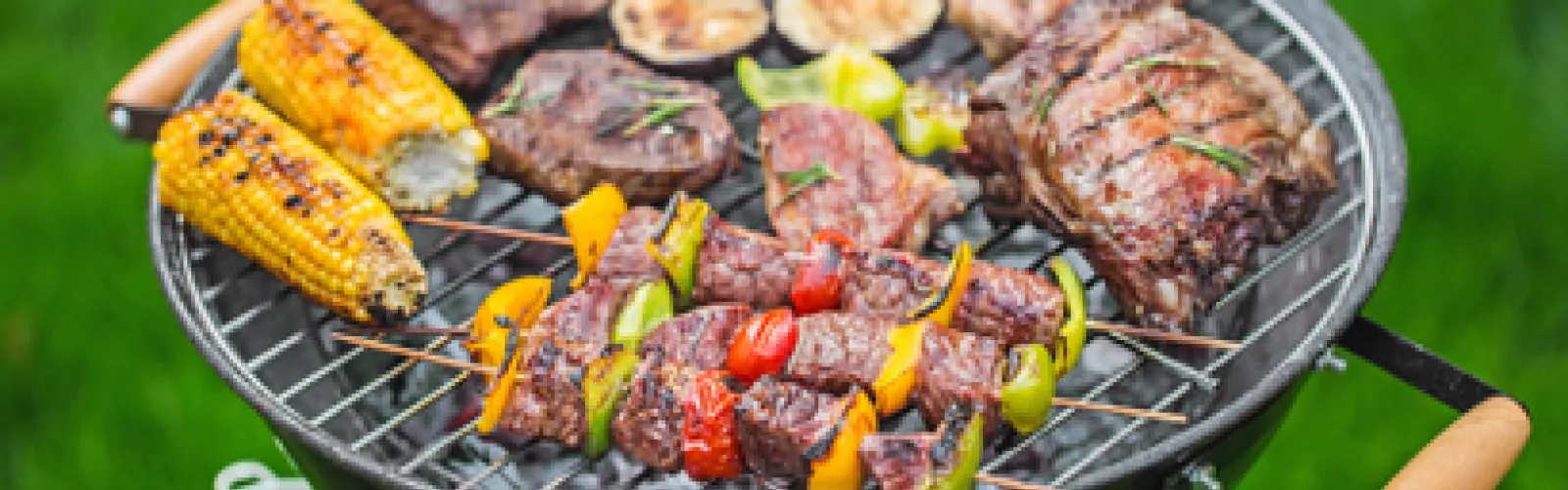 An assortment of food arranged on a grill.