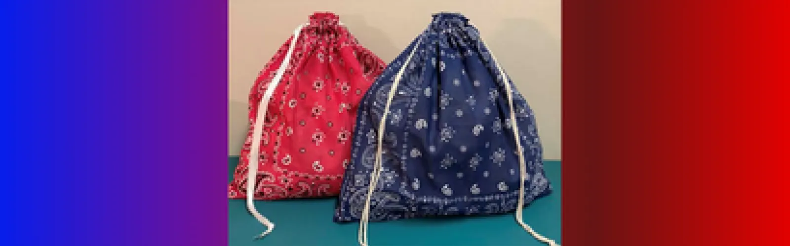 Two drawstring bags made out of bandanas.