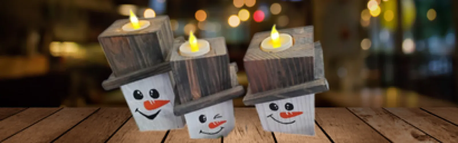 homemade wooden snowmen withtea lights
