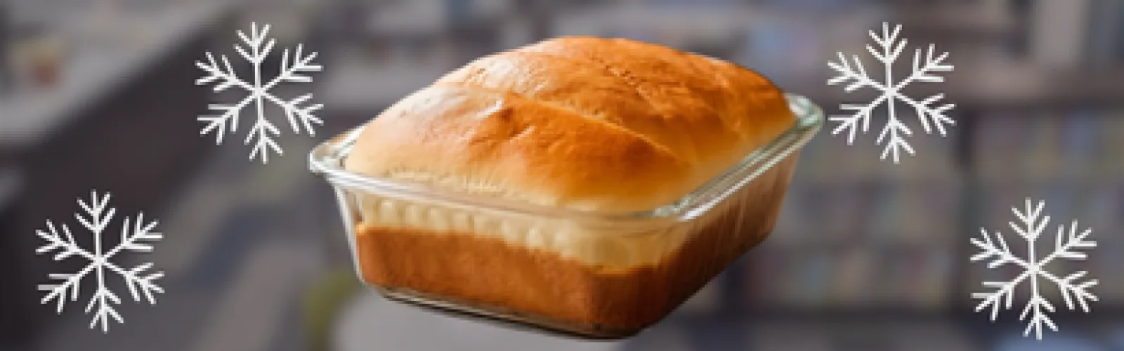 bread in a pan surronded by snowflakes